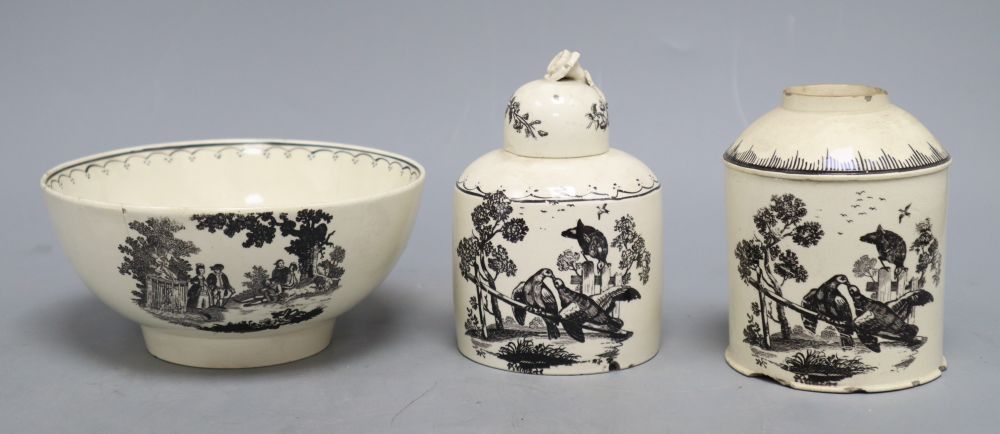 A late 18th century black transfer printed creamware bowl, diameter 14.5cm and two caddies with one cover